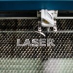 Industrial,Laser,Engraving,Word,"laser",On,The,Metal,Tray,Background,